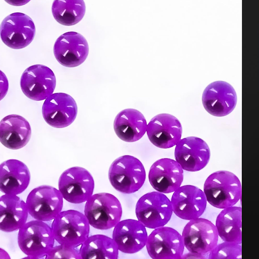 a close up of a purple remote control 